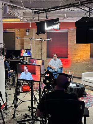 Man speaking in a studio setting