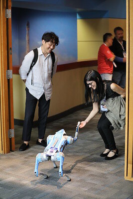 people ineracting with the Nagios robot dog