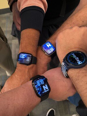 Four smartwatches displaying Nagios-branded watch faces.