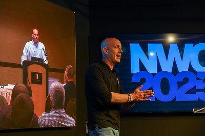 Speaker presenting at NWC 2025.